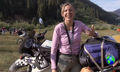 Is it safe for a woman to travel alone on a motorcycle across the country?